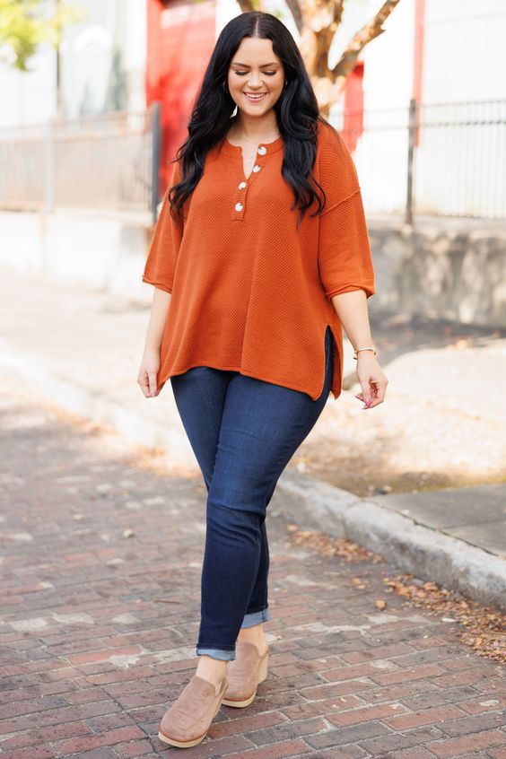 Pair a snake print blouse with figure hugging, skinny plus size jeans to create a stylish yet casual work ensemble