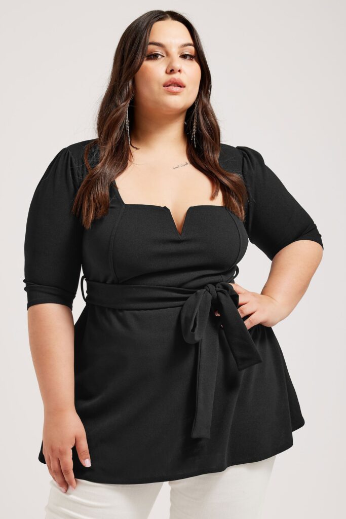 Try these black straight leg jeans, a plus size black shirt that's available on Amazon, and a black shirt to create a striking plus size workwear ensemble